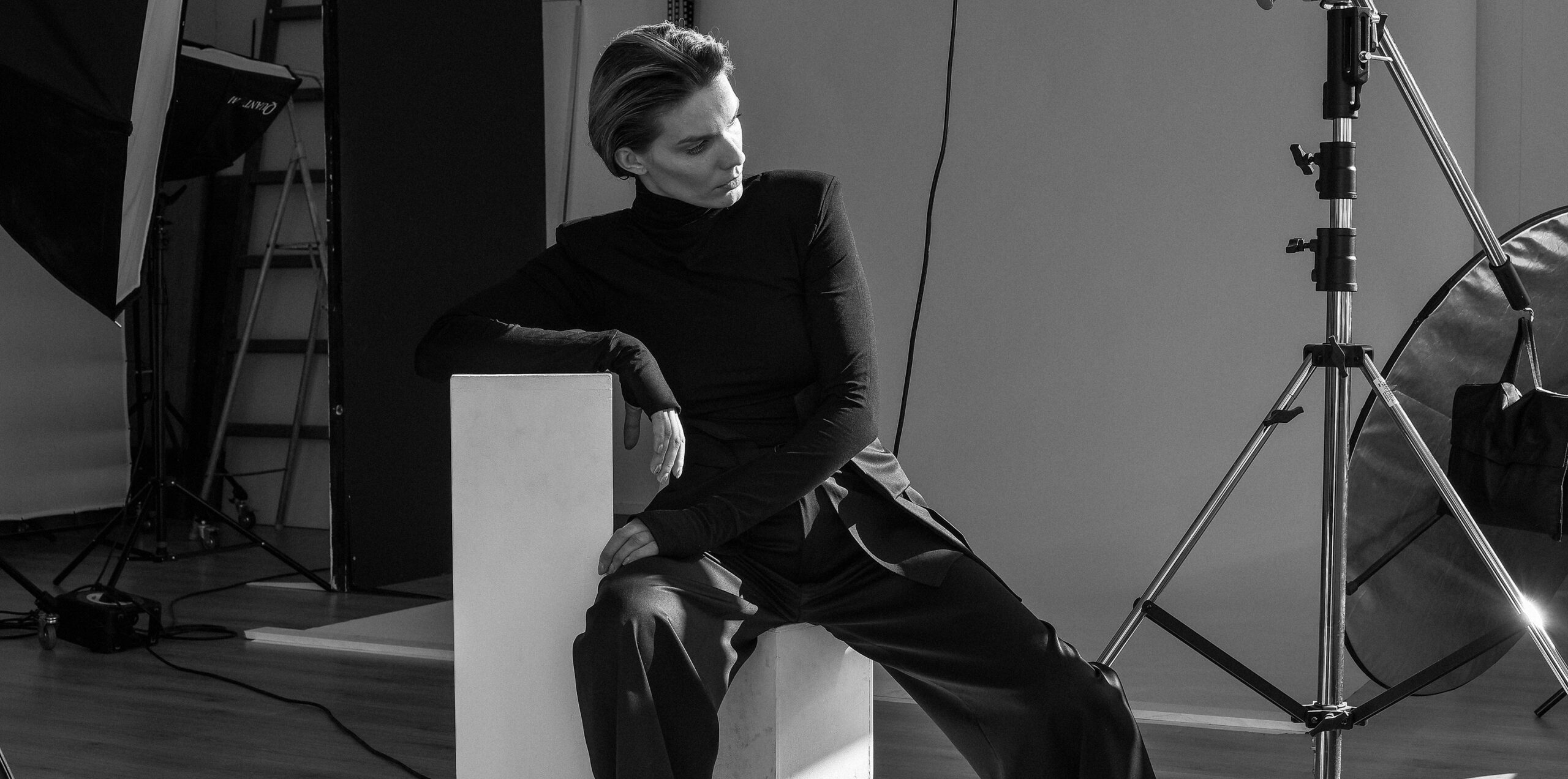 model with black turtleneck